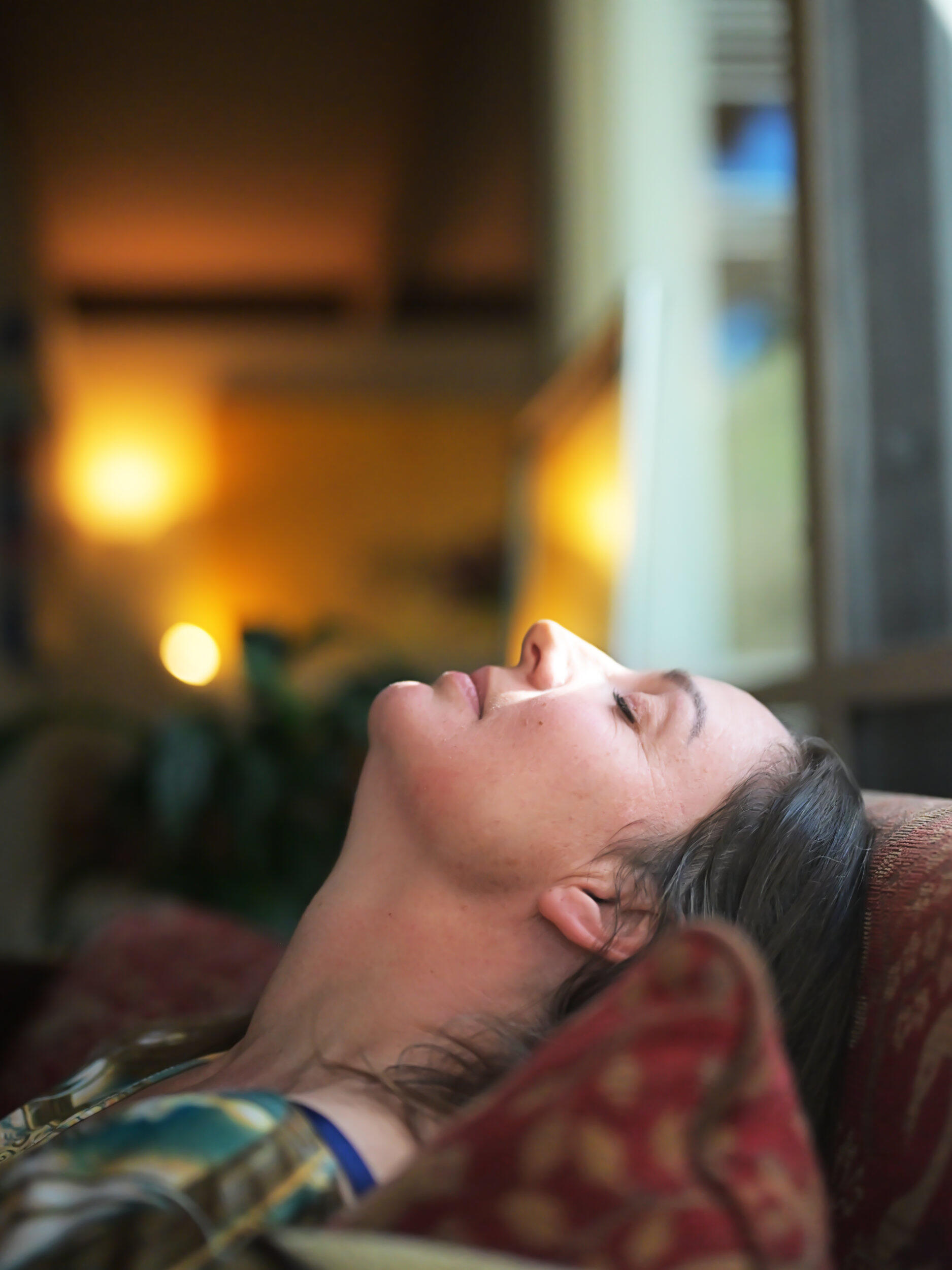 This portrait was captured at her home in Glen Iris, Victoria. I loved the background lighting and the sun through the window while she rested her head on the couch in meditation