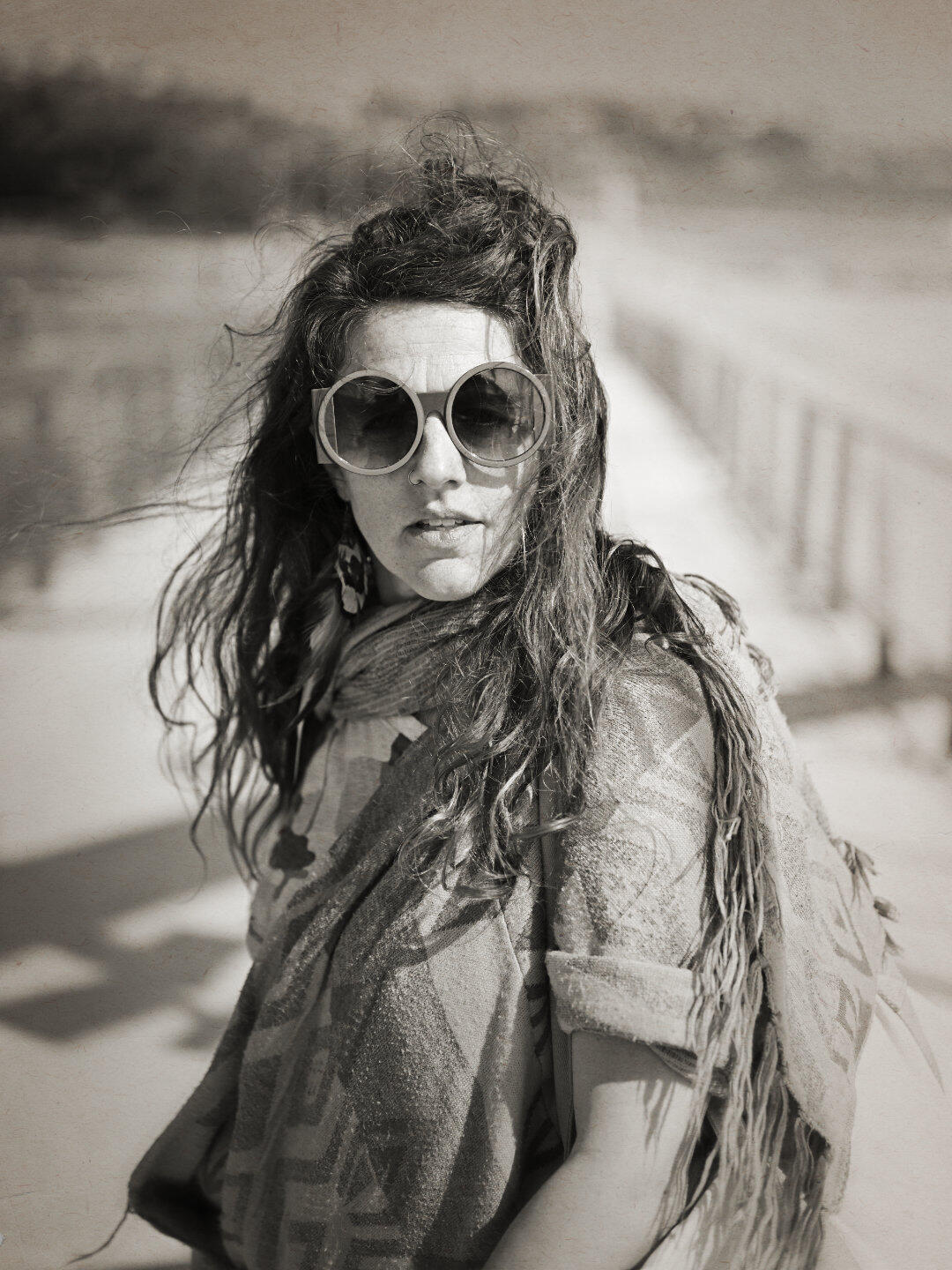 Feminine Dystopia Captured on the Frankston foreshore bridge, I brought a bit of a dystopian vibe to her usual funky attire. The black and white sepia feel really brings it to this portrait